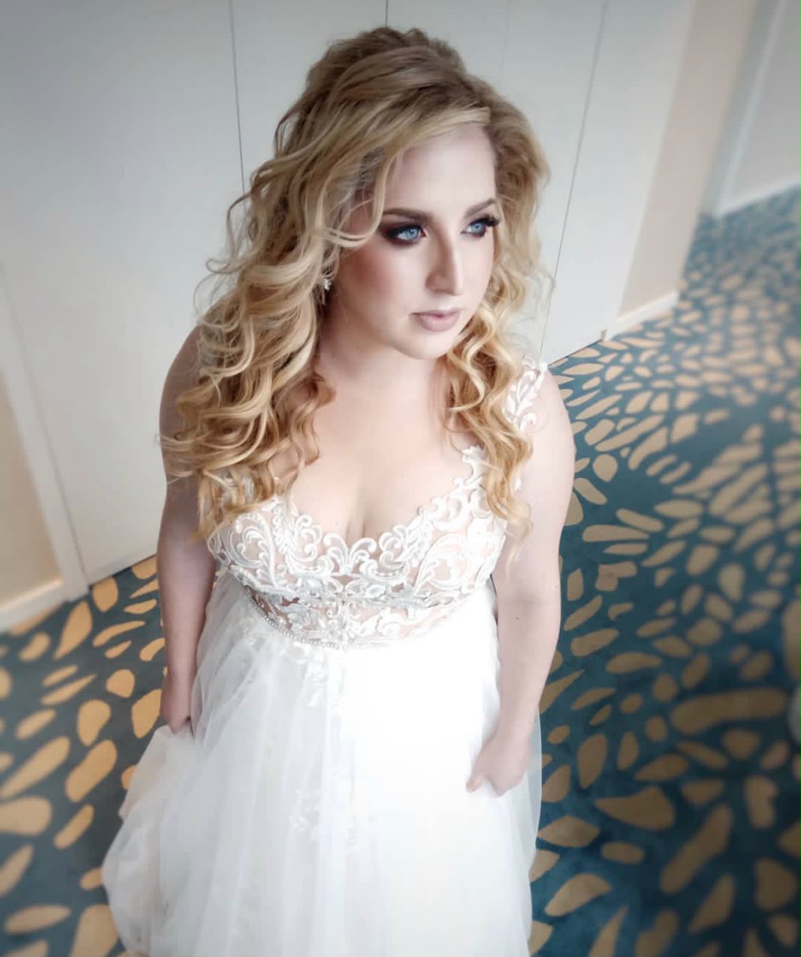 Bridal look by Lee Elrom — romantic curls with sultry eye makeup and lace-detailed gown