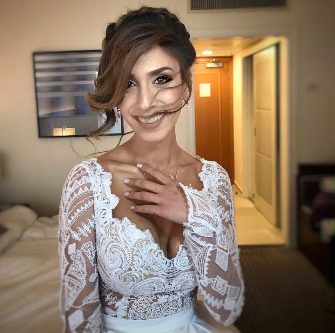 Bridal look by Lee Elrom — textured updo with soft glam in a long-sleeve lace gown